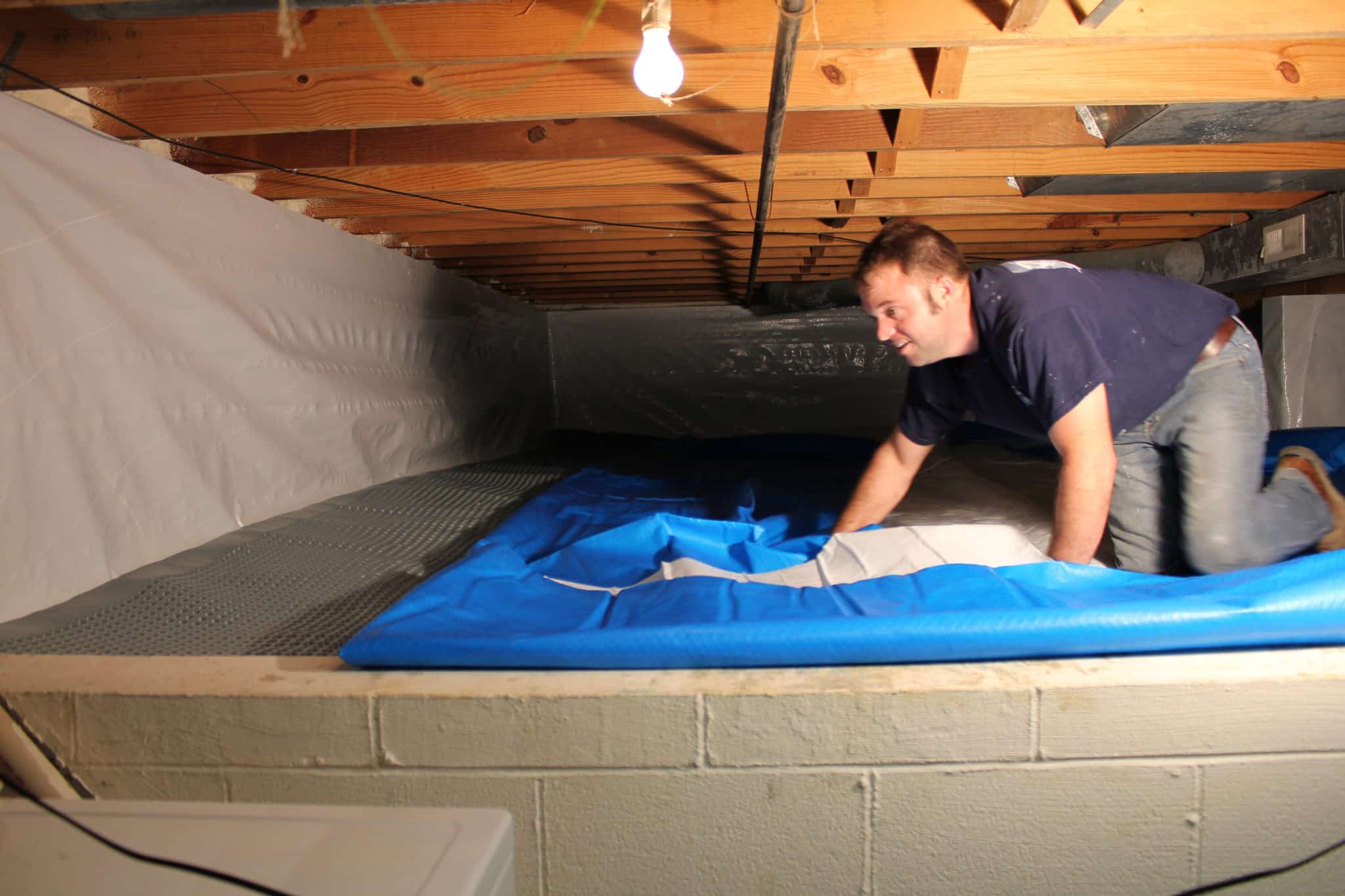 man inside of a crawlspace